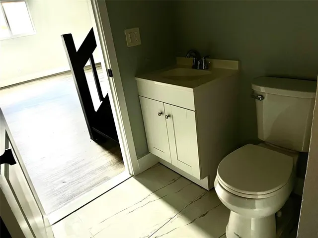 a bathroom with a sink and a toilet