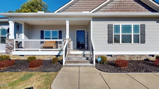 a kitchen with a stove and a wooden floor