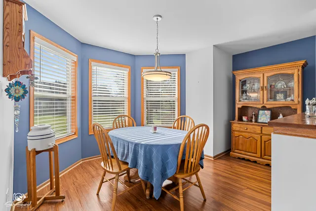 a view of a dining room with furniture window and outside view