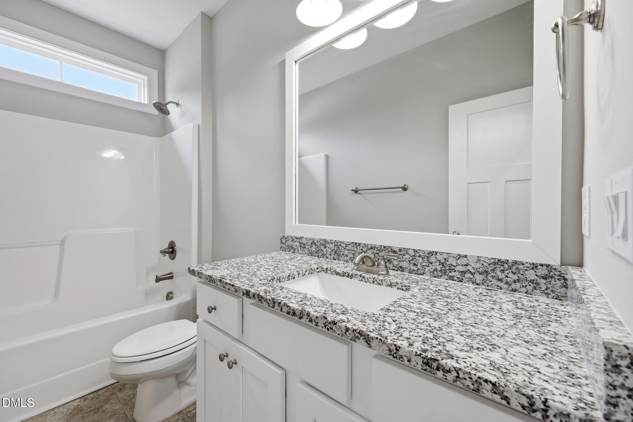 709 South Pollock Street Selma, NC 27576 - Photo 17 of 30 a bathroom with a sink a toilet and shower