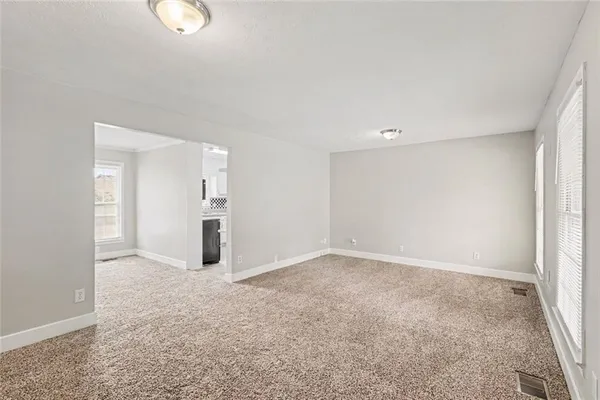an empty room with a bathroom