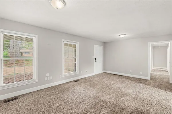 an empty room with windows