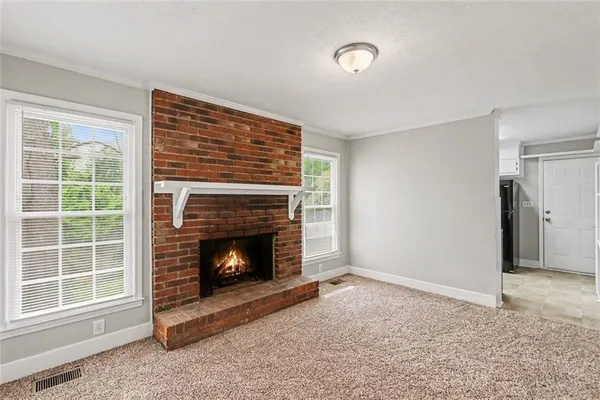 a living room with a fireplace
