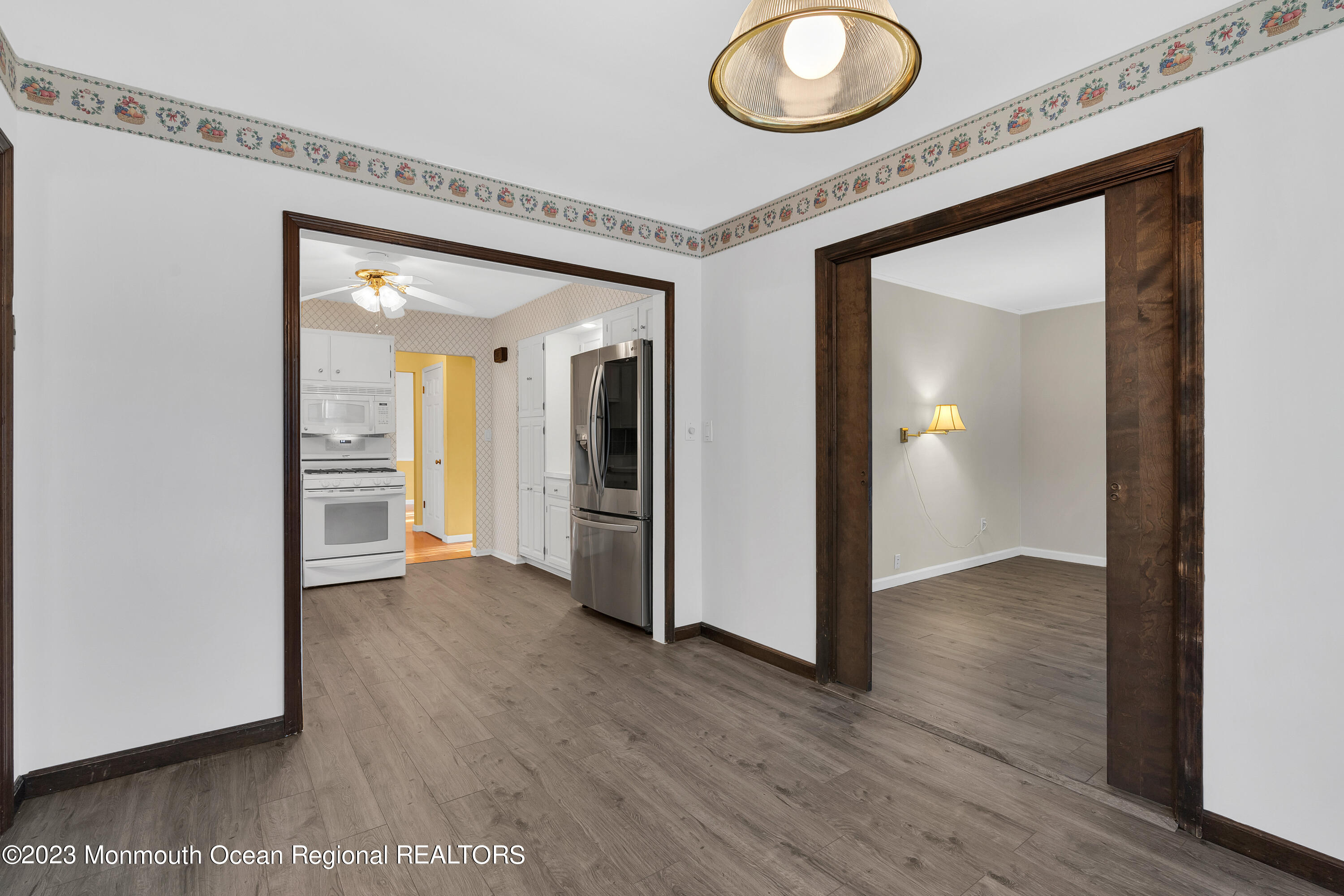 14 Daniel Drive Matawan, NJ 07747 - Photo 17 of 48 a view of a hallway with wooden floor and a bathroom