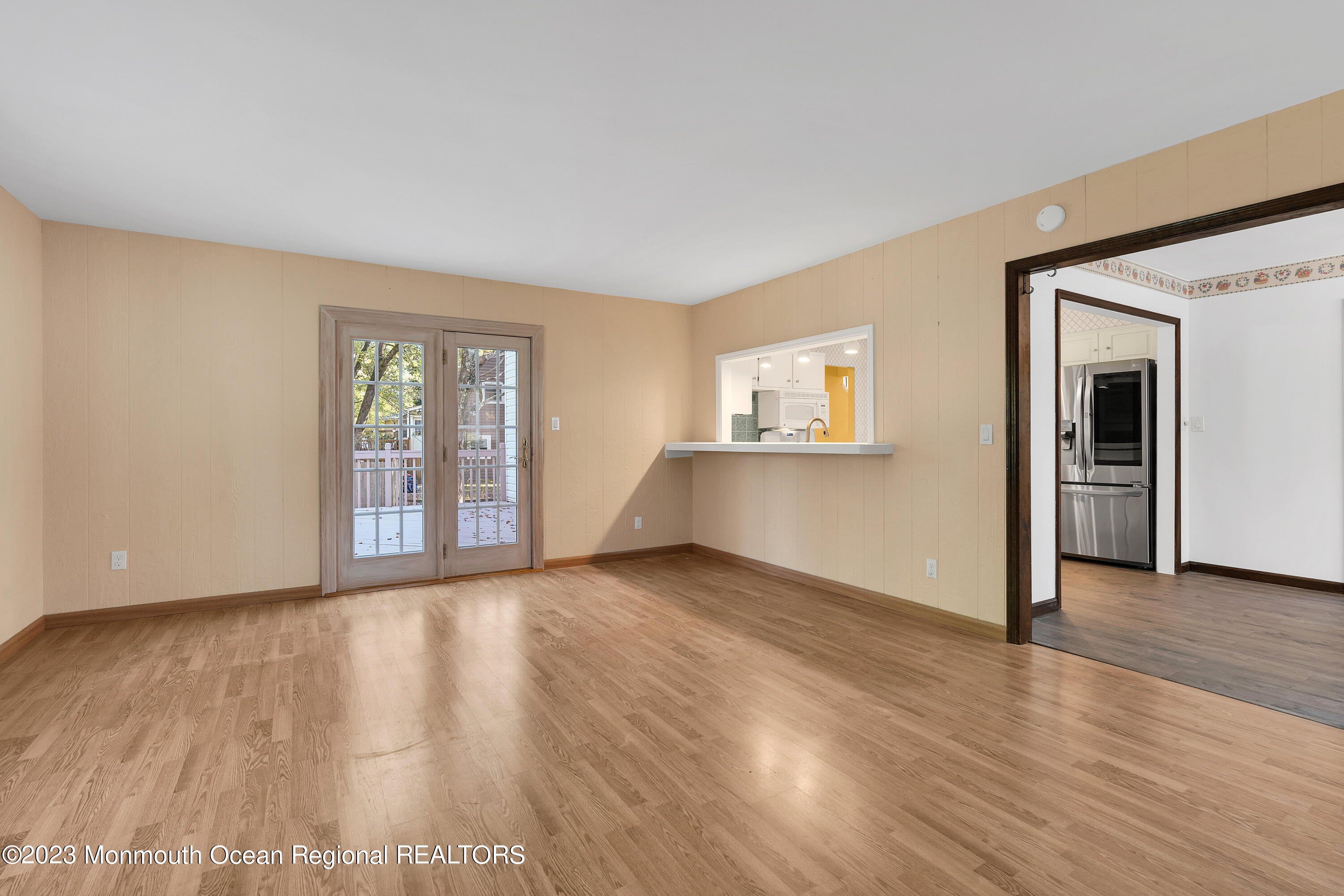 14 Daniel Drive Matawan, NJ 07747 - Photo 24 of 48 a view of an empty room with wooden floor and a window