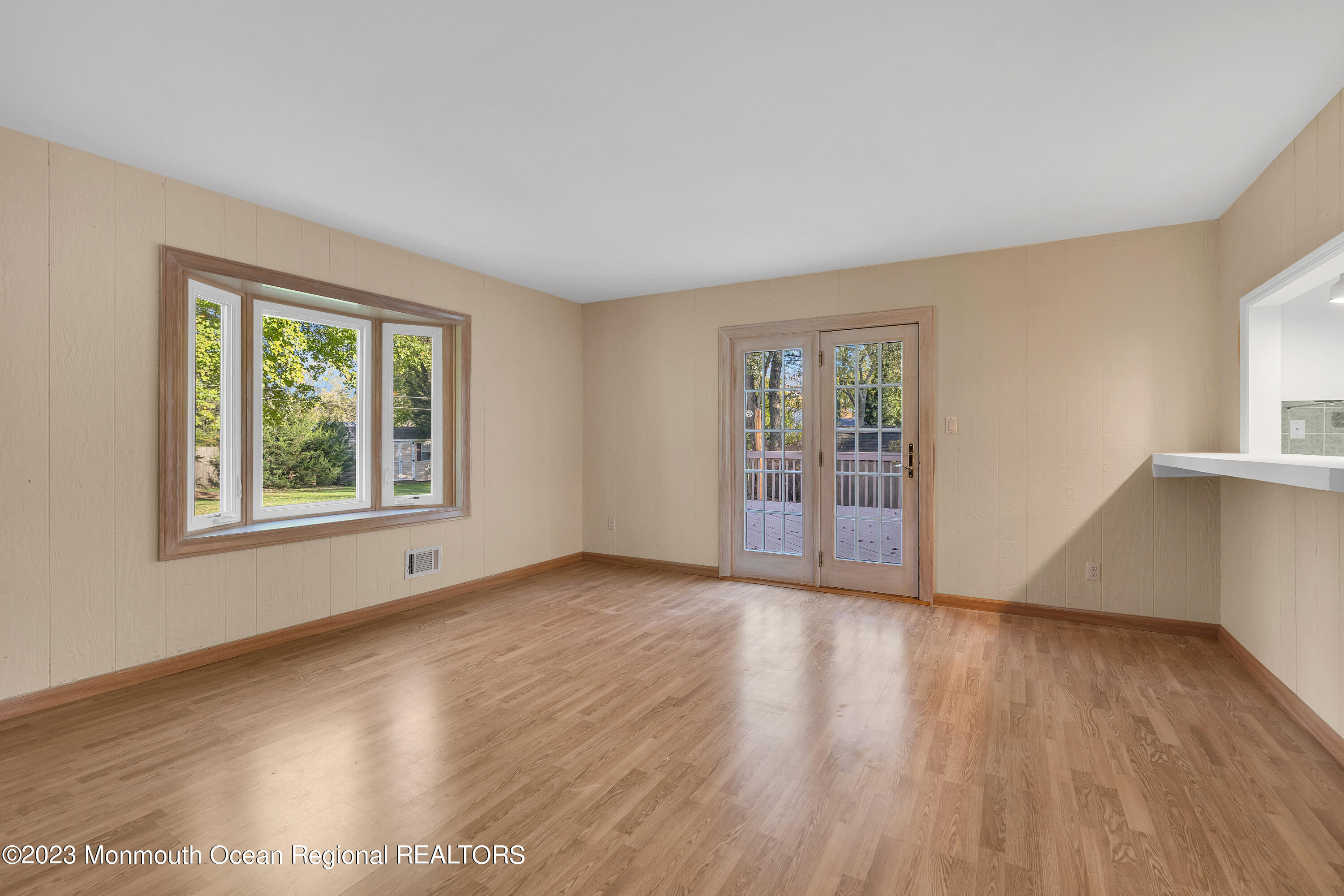 14 Daniel Drive Matawan, NJ 07747 - Photo 25 of 48 a view of an empty room with wooden floor and a window