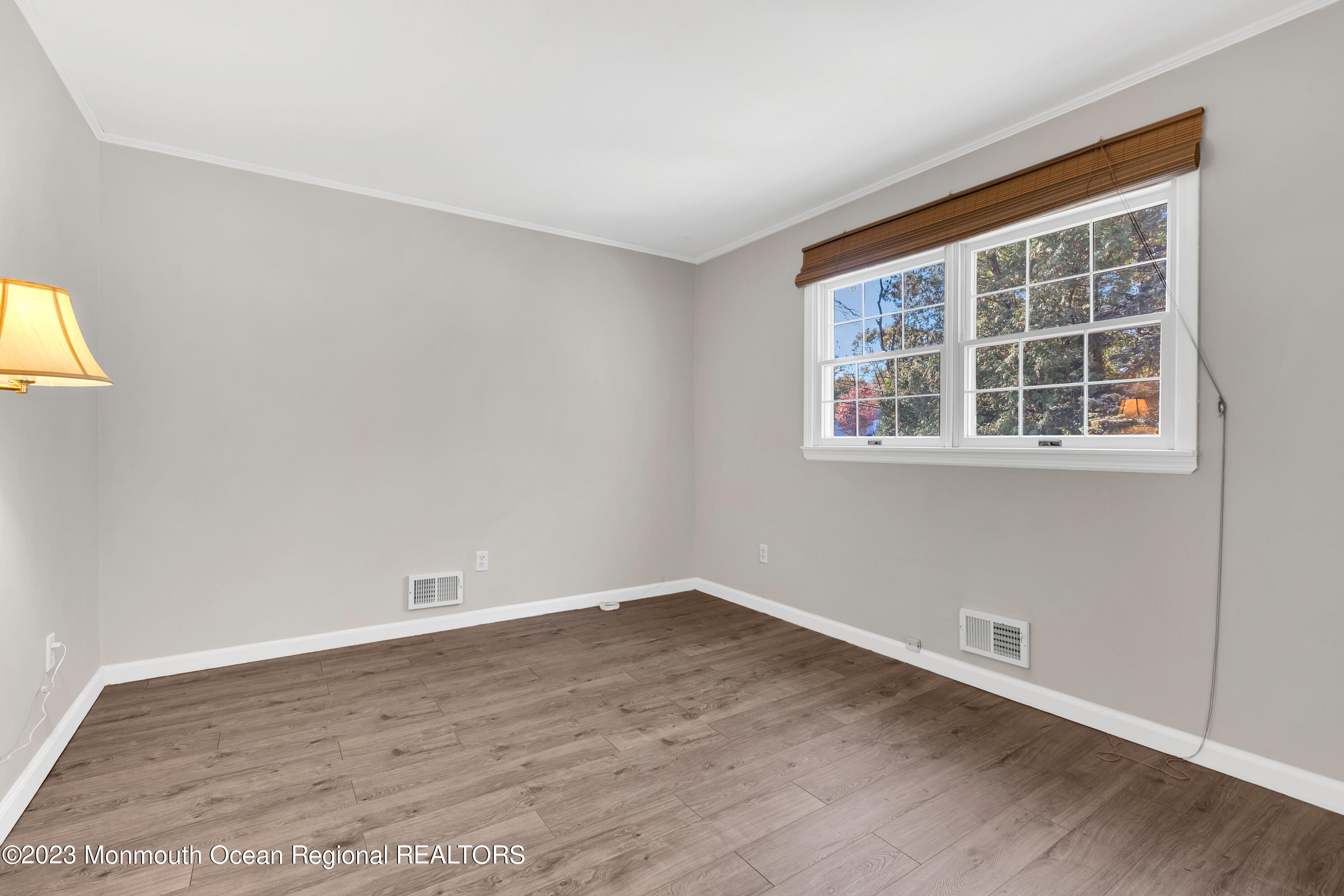 14 Daniel Drive Matawan, NJ 07747 - Photo 26 of 48 wooden floor in an empty room with a window