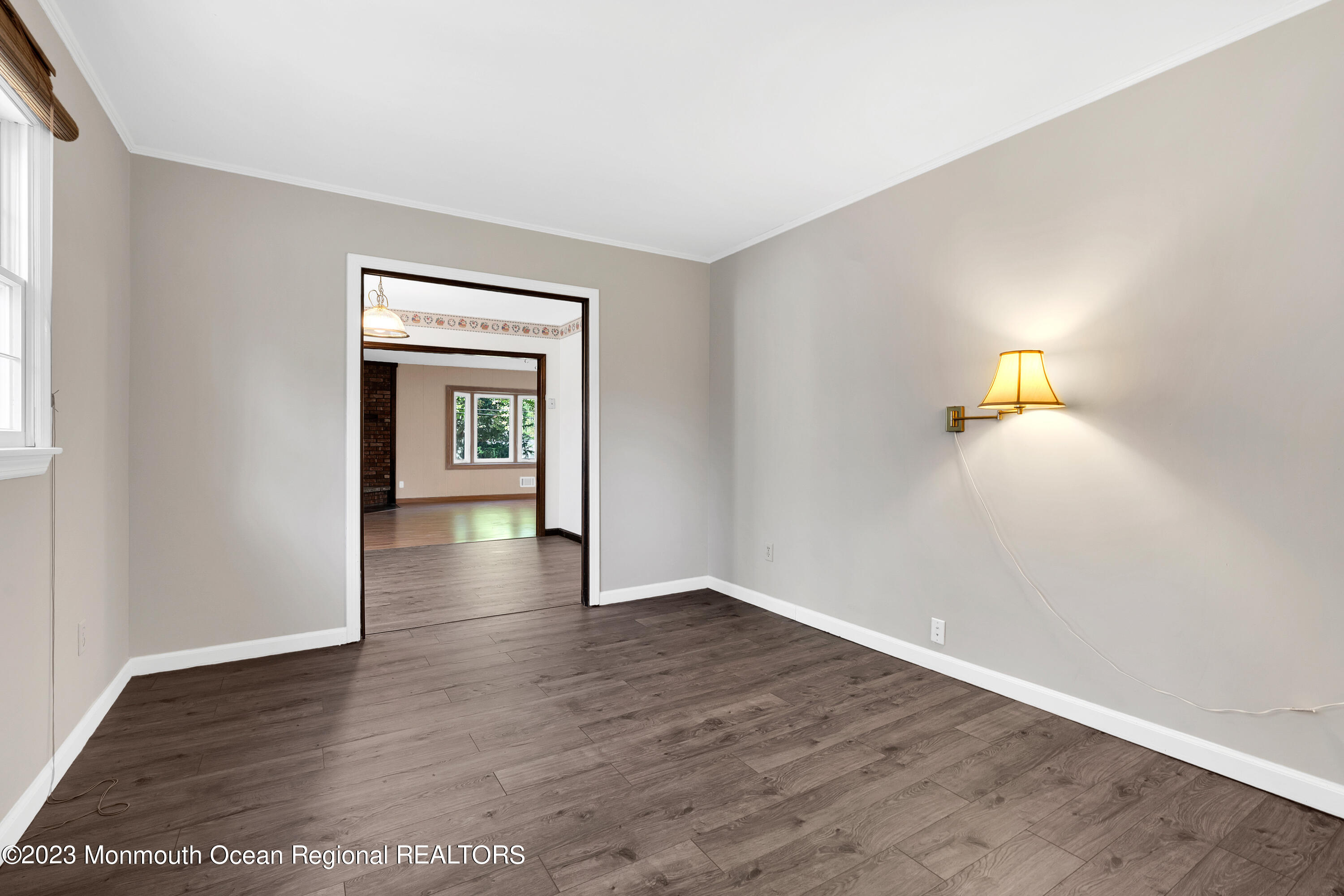 14 Daniel Drive Matawan, NJ 07747 - Photo 27 of 48 a view of an empty room with wooden floor and a window