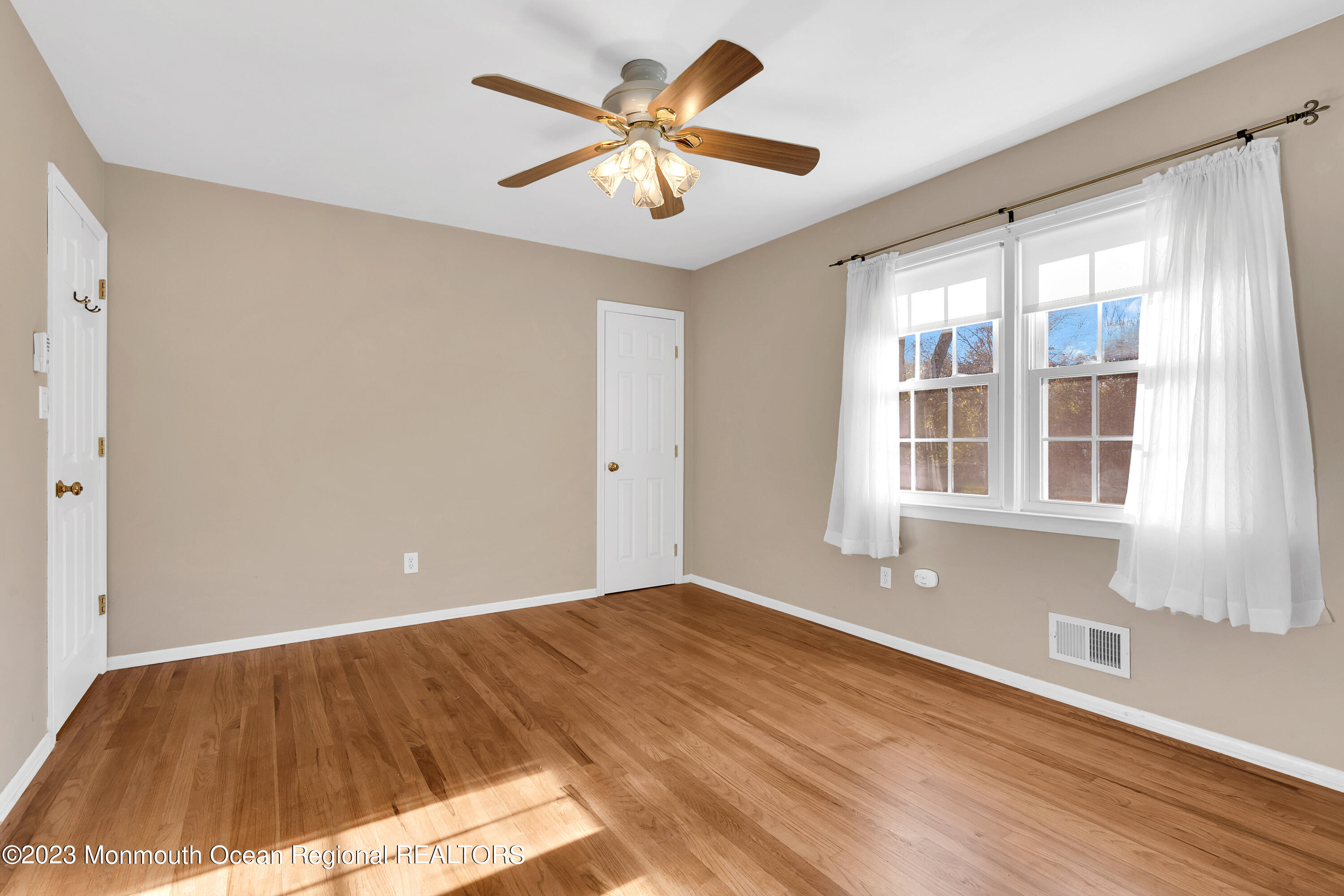 14 Daniel Drive Matawan, NJ 07747 - Photo 31 of 48 a view of an empty room with window and a kitchen