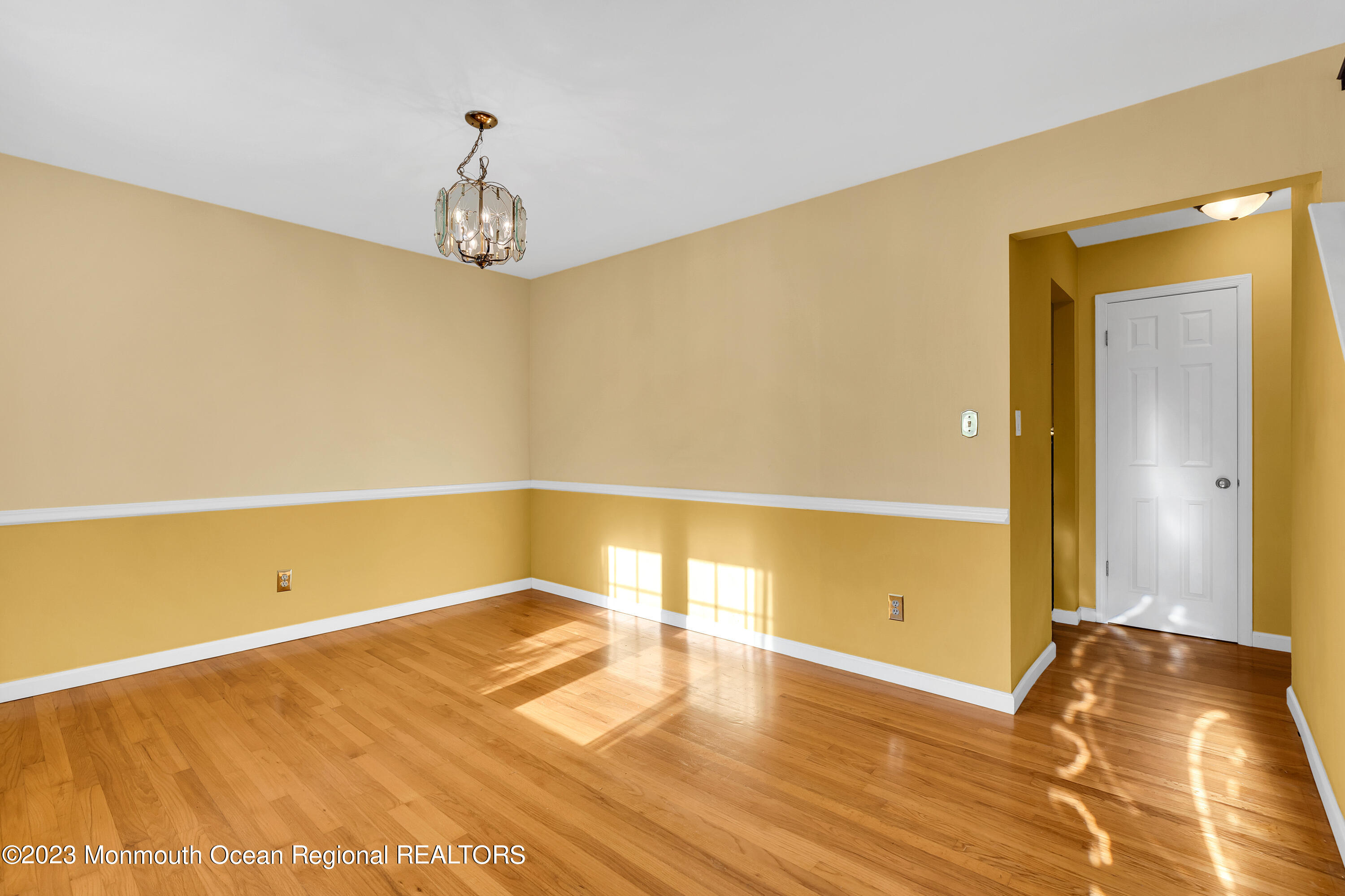 14 Daniel Drive Matawan, NJ 07747 - Photo 4 of 48 a view of a room with wooden floor and a ceiling fan