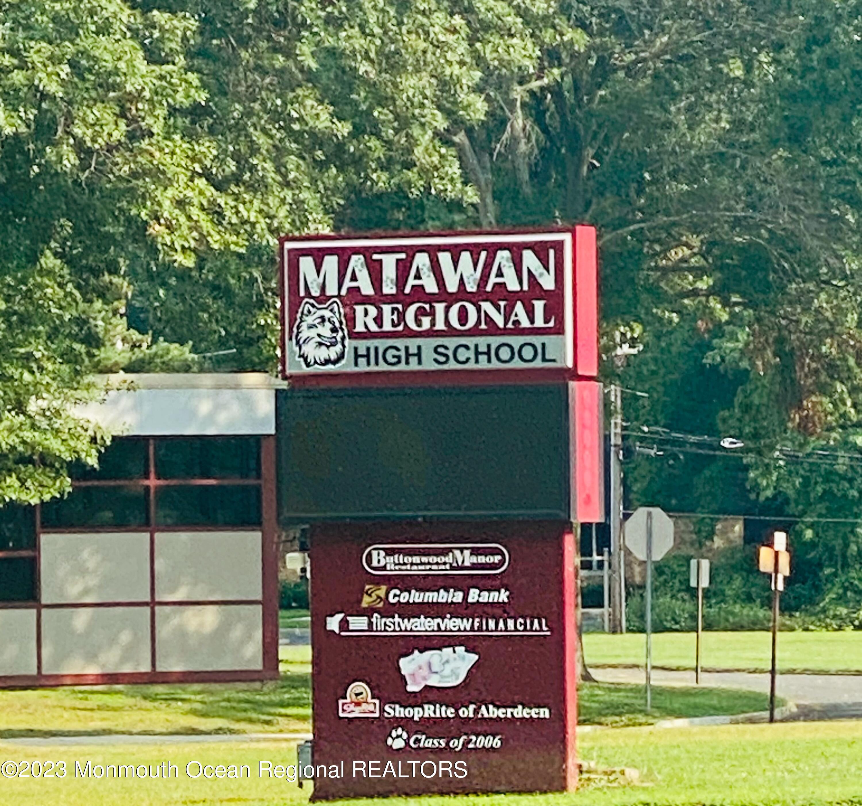 14 Daniel Drive Matawan, NJ 07747 - Photo 47 of 48 a sign on the side of the road