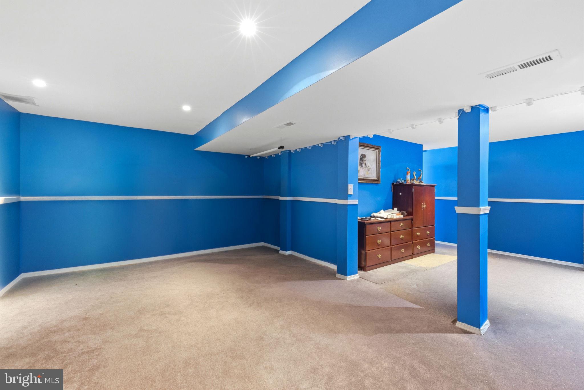 17 Paddock Road Marlton, NJ 08053 - Photo 41 of 54 Vibrant blue walls create a lively space.