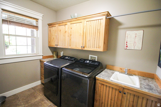 288 525 South Providence, UT 84332 - Photo 15 of 71 Laundry room with cabinet space and washer and dryer
