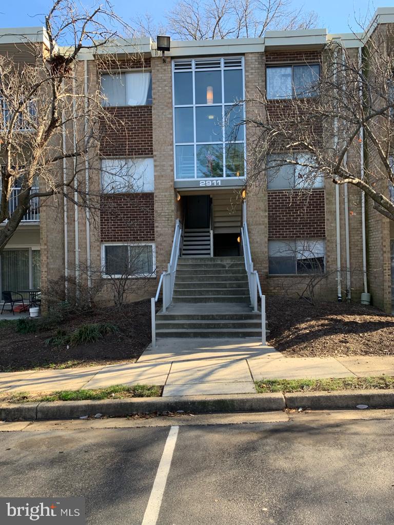 2911 Charing Cross Road, Unit 10 Falls Church, VA 22042 - Photo 1 of 25 a view of a house with a door and a fireplace
