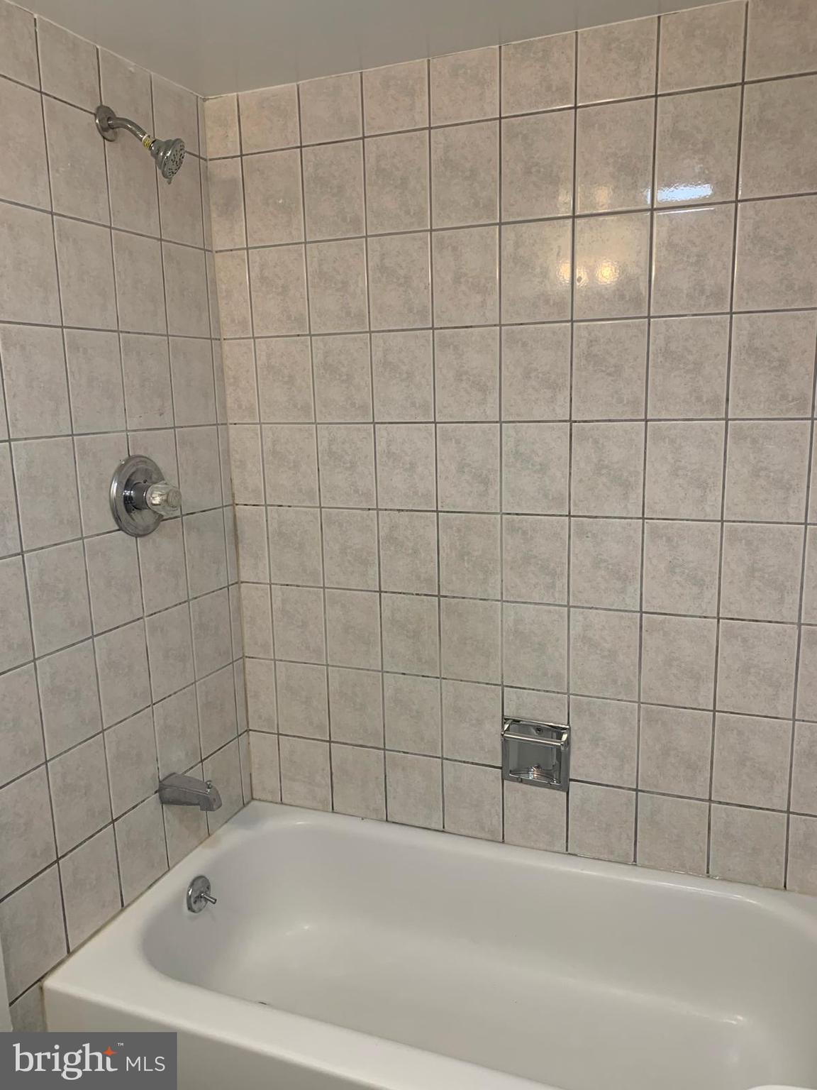 2911 Charing Cross Road, Unit 10 Falls Church, VA 22042 - Photo 13 of 25 a bathroom with a bathtub