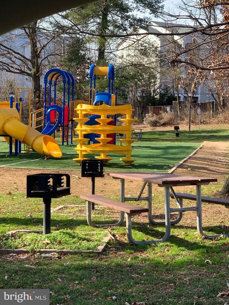 2911 Charing Cross Road, Unit 10 Falls Church, VA 22042 - Photo 20 of 25 a bench is sitting in the middle of a park