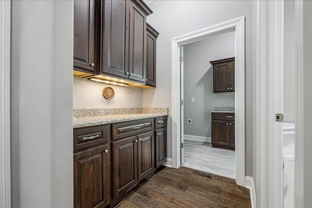 a view of a kitchen from the hallway