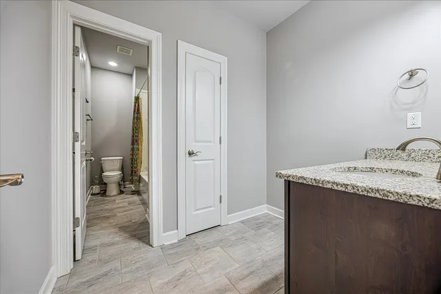a view of a bathroom from a hallway