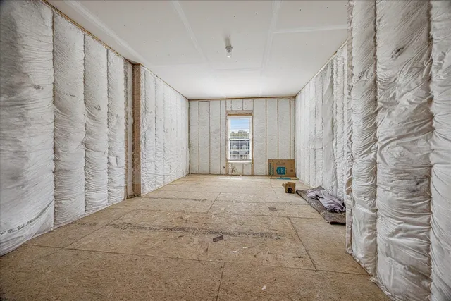 a view of empty room with floor to ceiling window