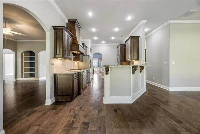 a view of a kitchen with wooden floor