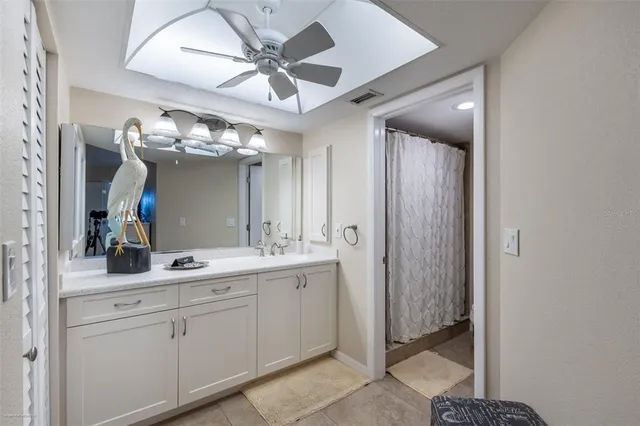 a bathroom with a sink and mirror