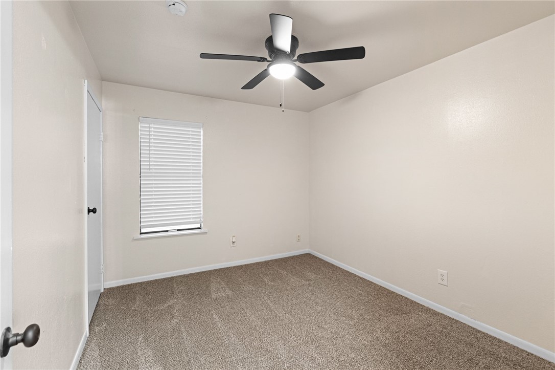 5921 Riley Drive Corpus Christi, TX 78412 - Photo 14 of 20 an empty room with a window and a fan