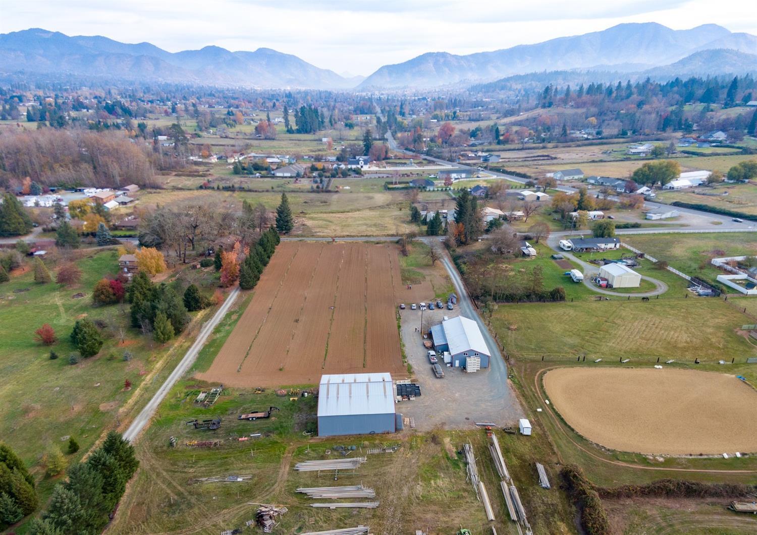 1496 Boundary Road Grants Pass, OR 97527 - Photo 6 of 26 an aerial view of residential houses with outdoor space and river