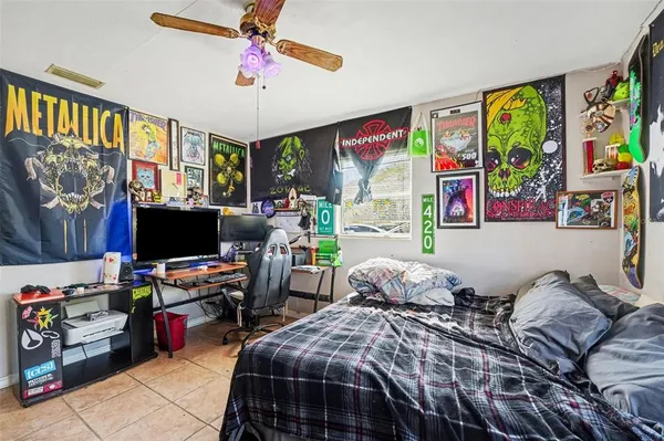a bedroom with bed and a window