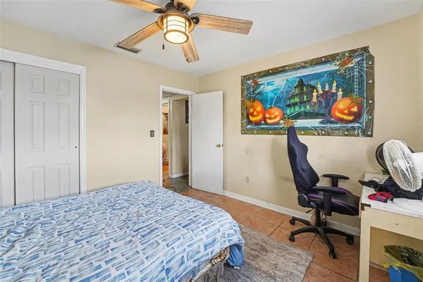 a bedroom that has a bed and a chandelier