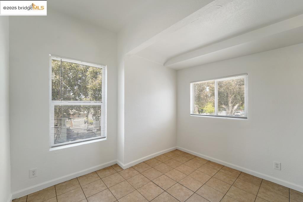 203 Bissell Avenue Richmond, CA 94801 - Photo 14 of 30 an empty room with windows