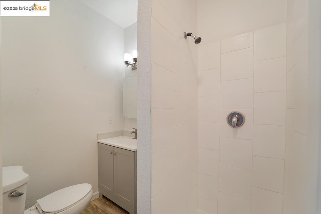 203 Bissell Avenue Richmond, CA 94801 - Photo 15 of 30 a bathroom with a sink a toilet and shower