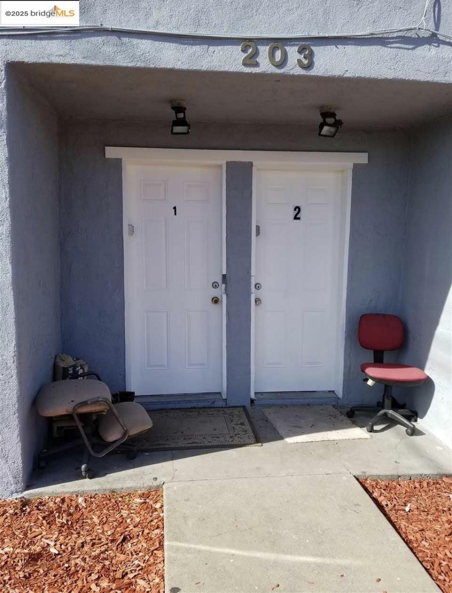 203 Bissell Avenue Richmond, CA 94801 - Photo 6 of 30 a bathroom with a granite countertop sink and a mirror