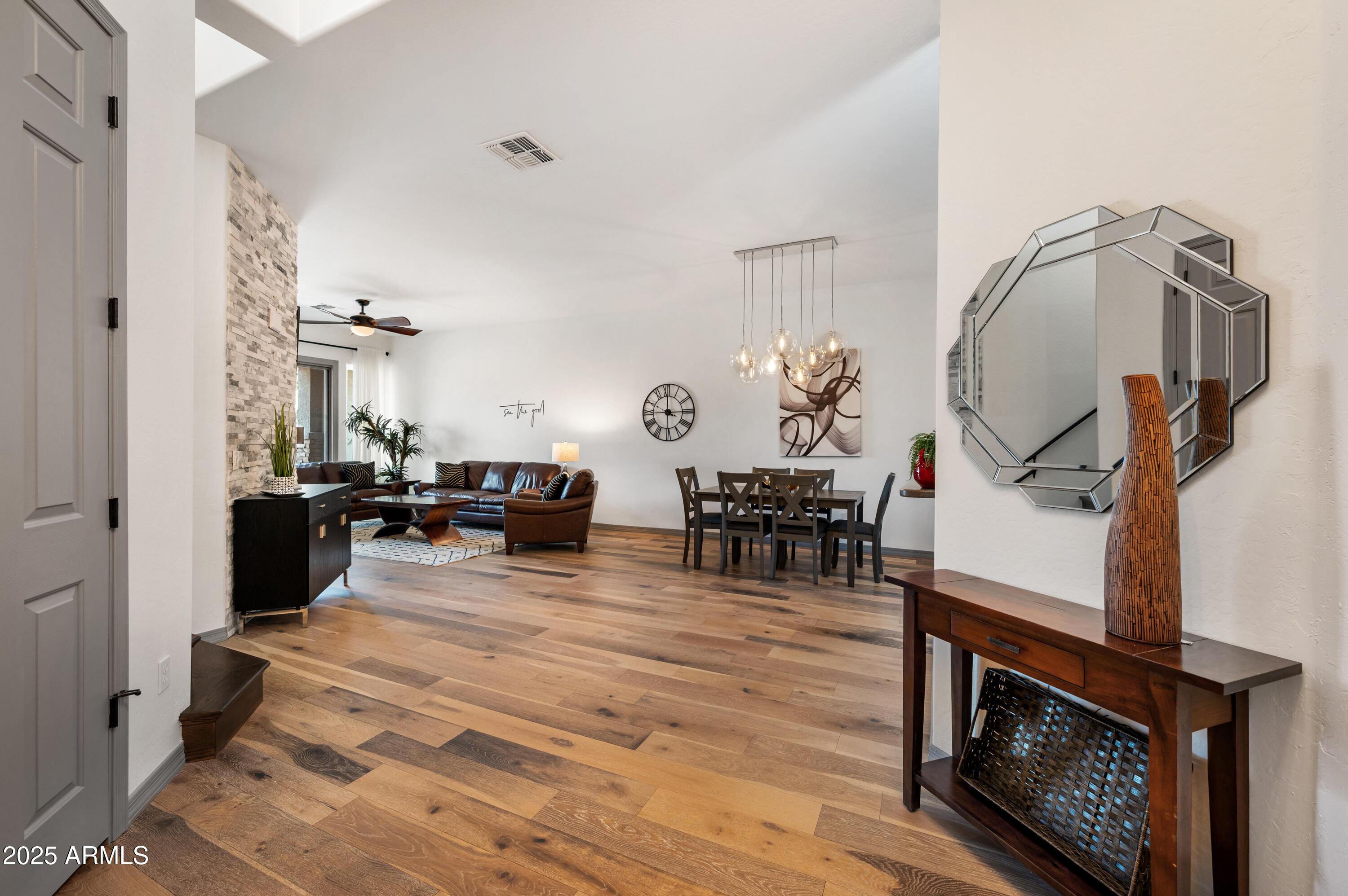 10172 East Dinosaur Ridge Road Gold Canyon, AZ 85118 - Photo 10 of 38 a living room with furniture a dining table and a fireplace