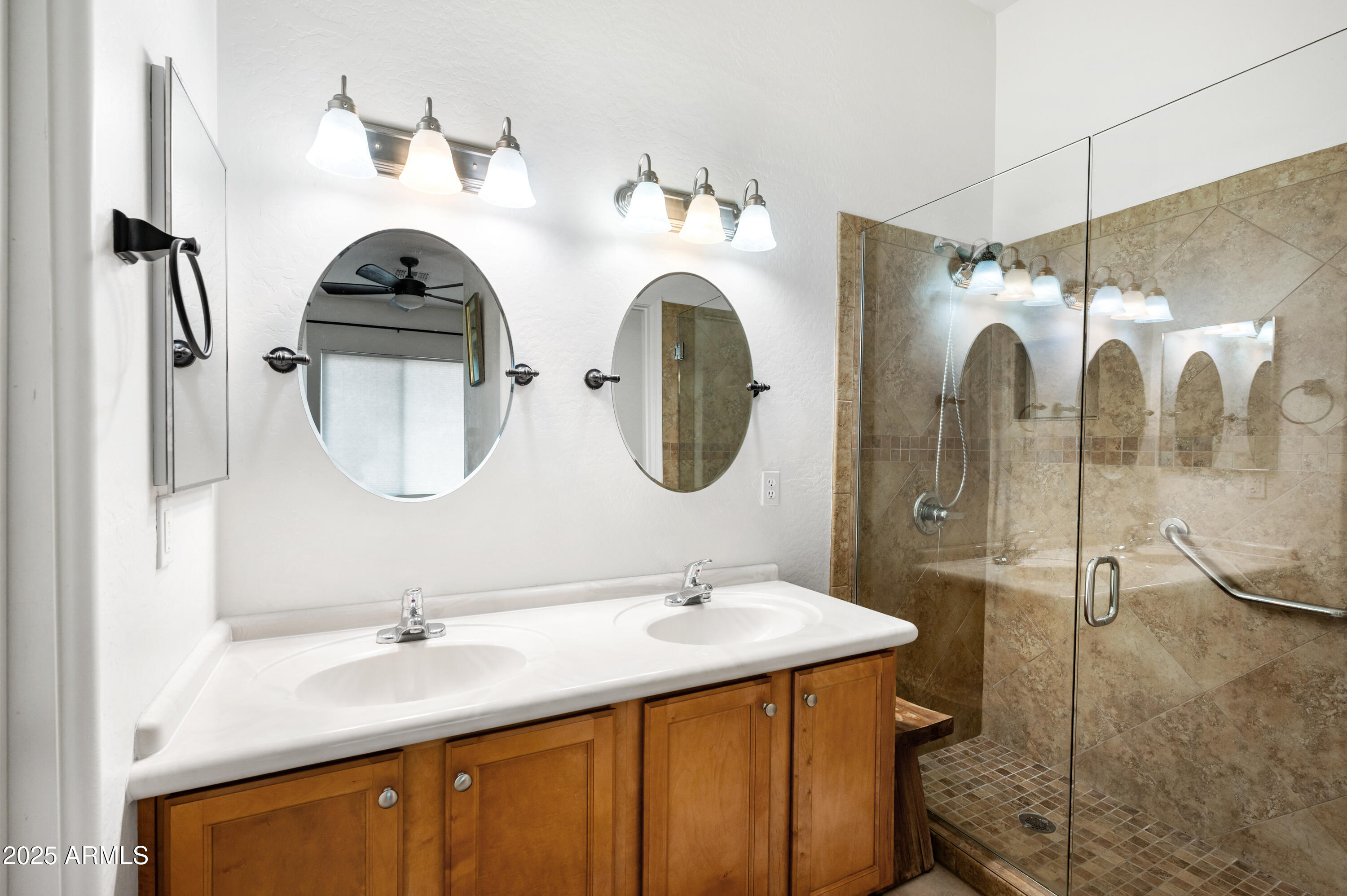10172 East Dinosaur Ridge Road Gold Canyon, AZ 85118 - Photo 17 of 38 a bathroom with a double vanity sink and a mirror