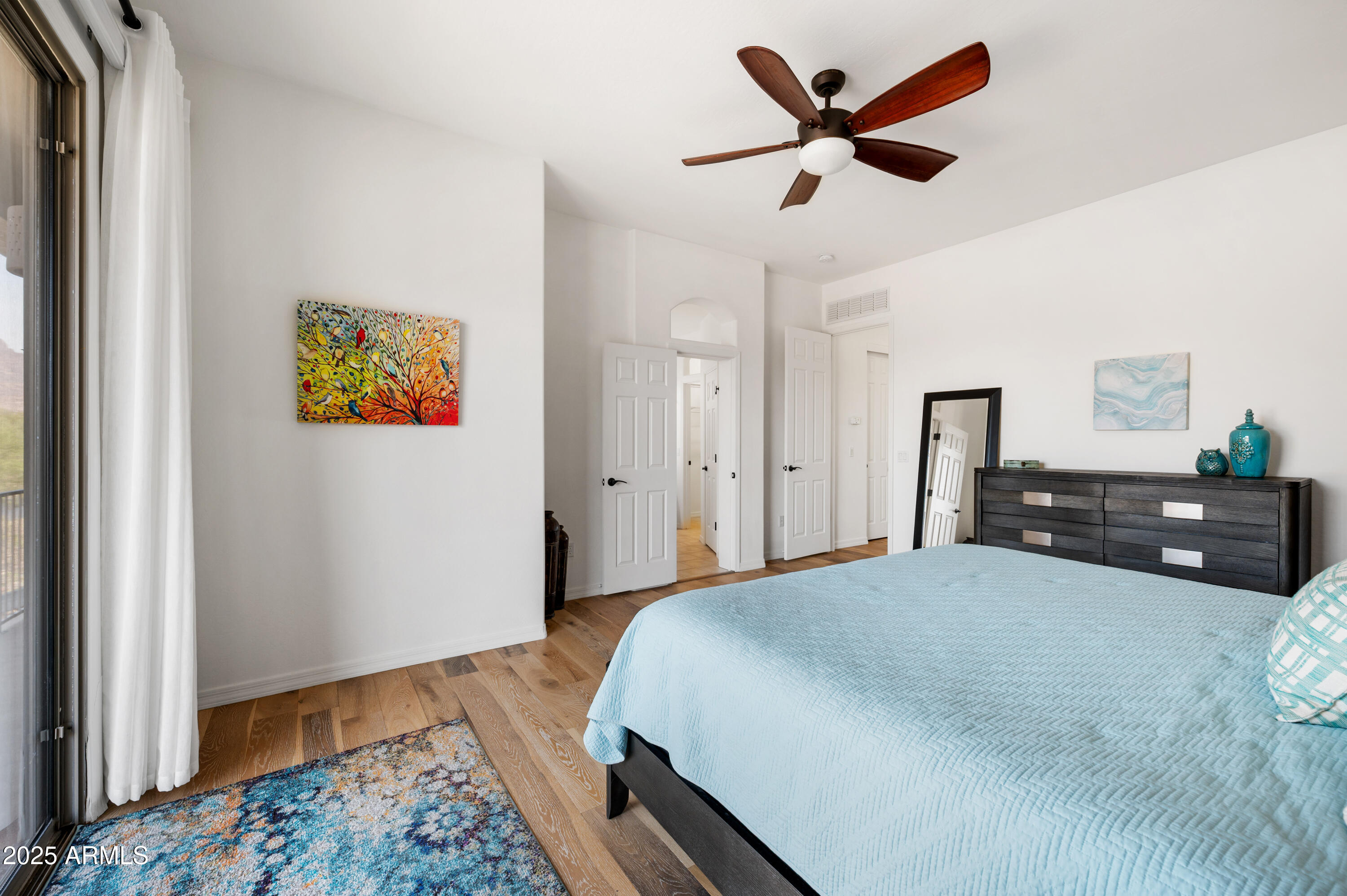 10172 East Dinosaur Ridge Road Gold Canyon, AZ 85118 - Photo 24 of 38 a bedroom with a bed and a dresser