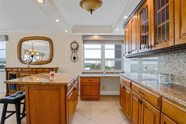 a kitchen with stainless steel appliances granite countertop a sink and cabinets