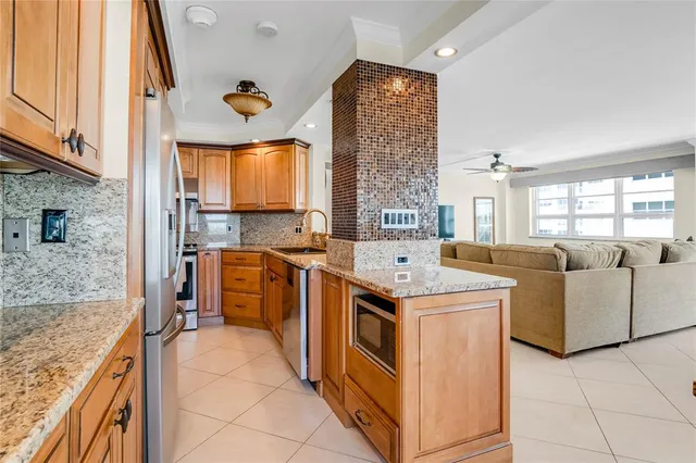 a kitchen that has a lot of cabinets in it