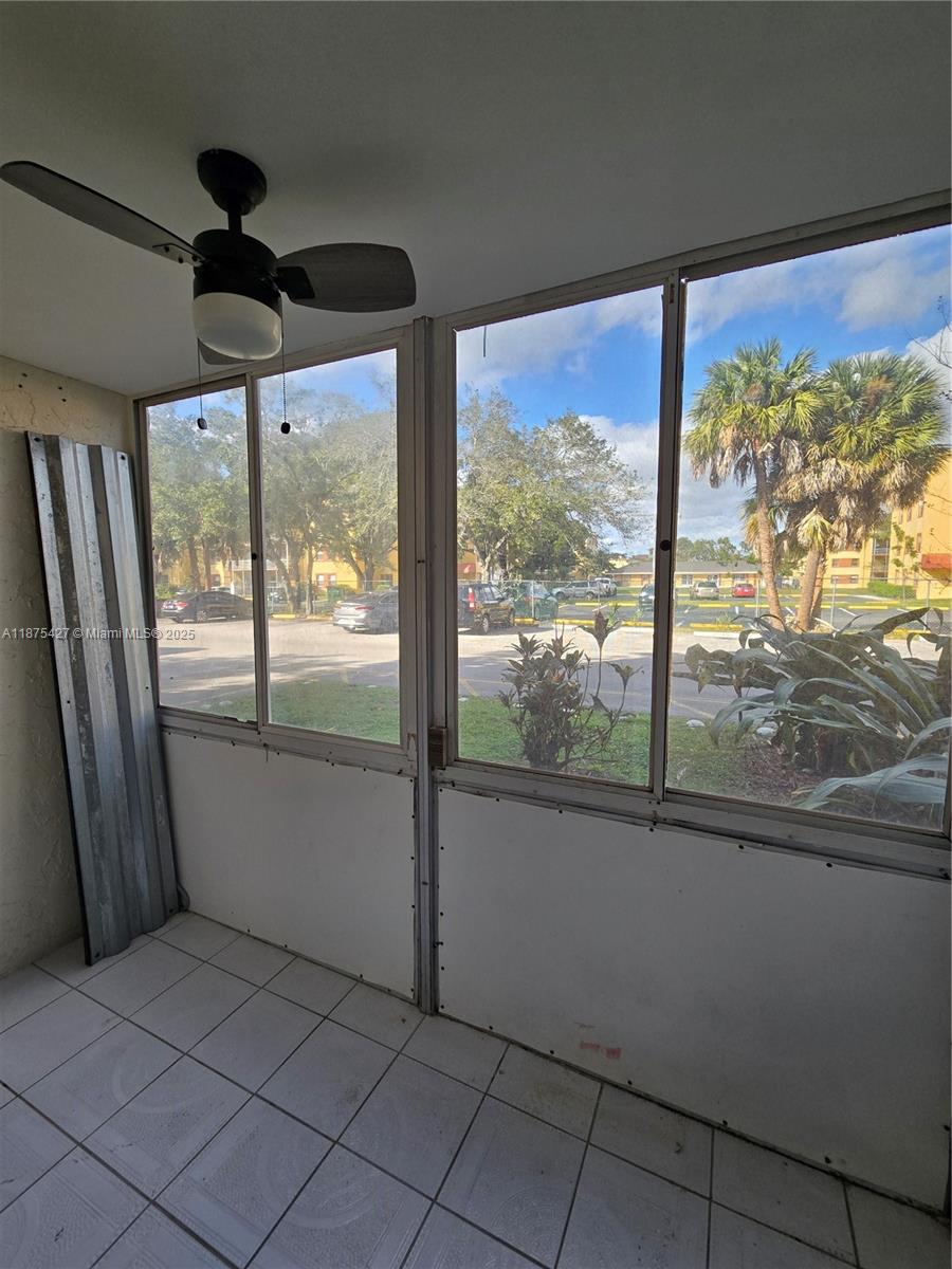 2800 Northwest 56th Avenue, Unit C104 Lauderhill, FL 33313 - Photo 17 of 17 a view of empty room with wooden floor and fan