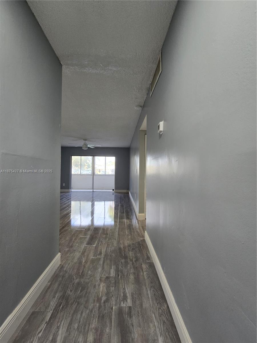 2800 Northwest 56th Avenue, Unit C104 Lauderhill, FL 33313 - Photo 7 of 17 a view of empty room with wooden floor