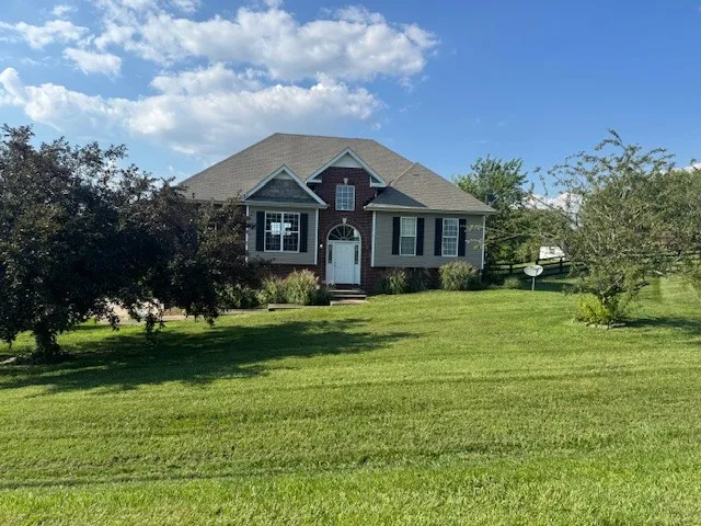 a front view of a house with a yard