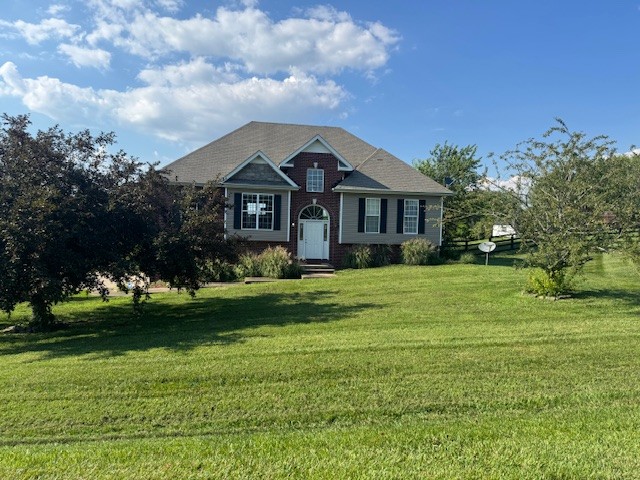 a front view of a house with a yard