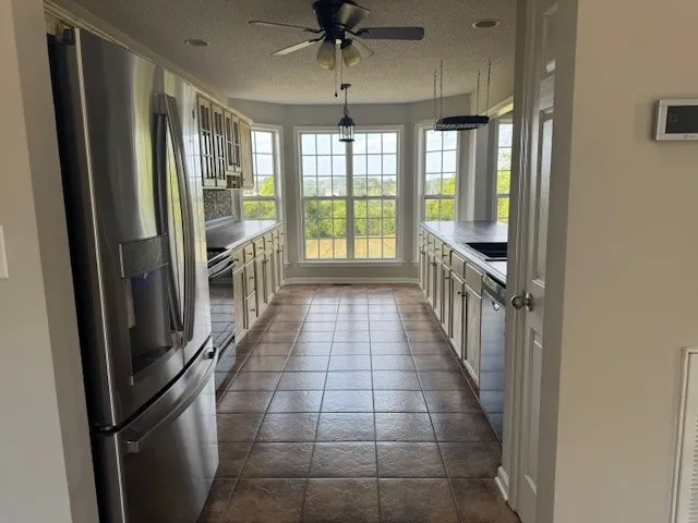 a view of a hallway with windows