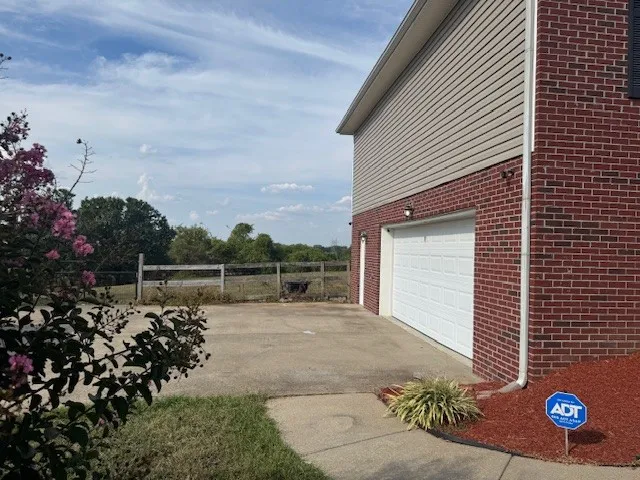 a view of a backyard of the house