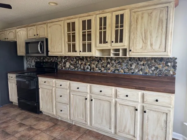 a kitchen with white cabinets