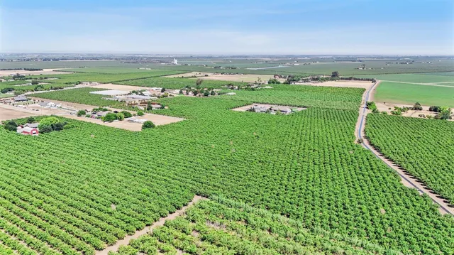 a kitchen with stainless steel appliances granite countertop a refrigerator a stove and a sink dishwasher