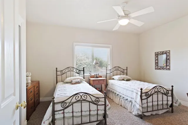 a view of a house with a backyard and a garage