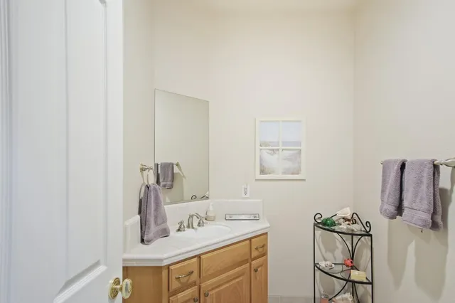 a view of a dirt road with trees in the background