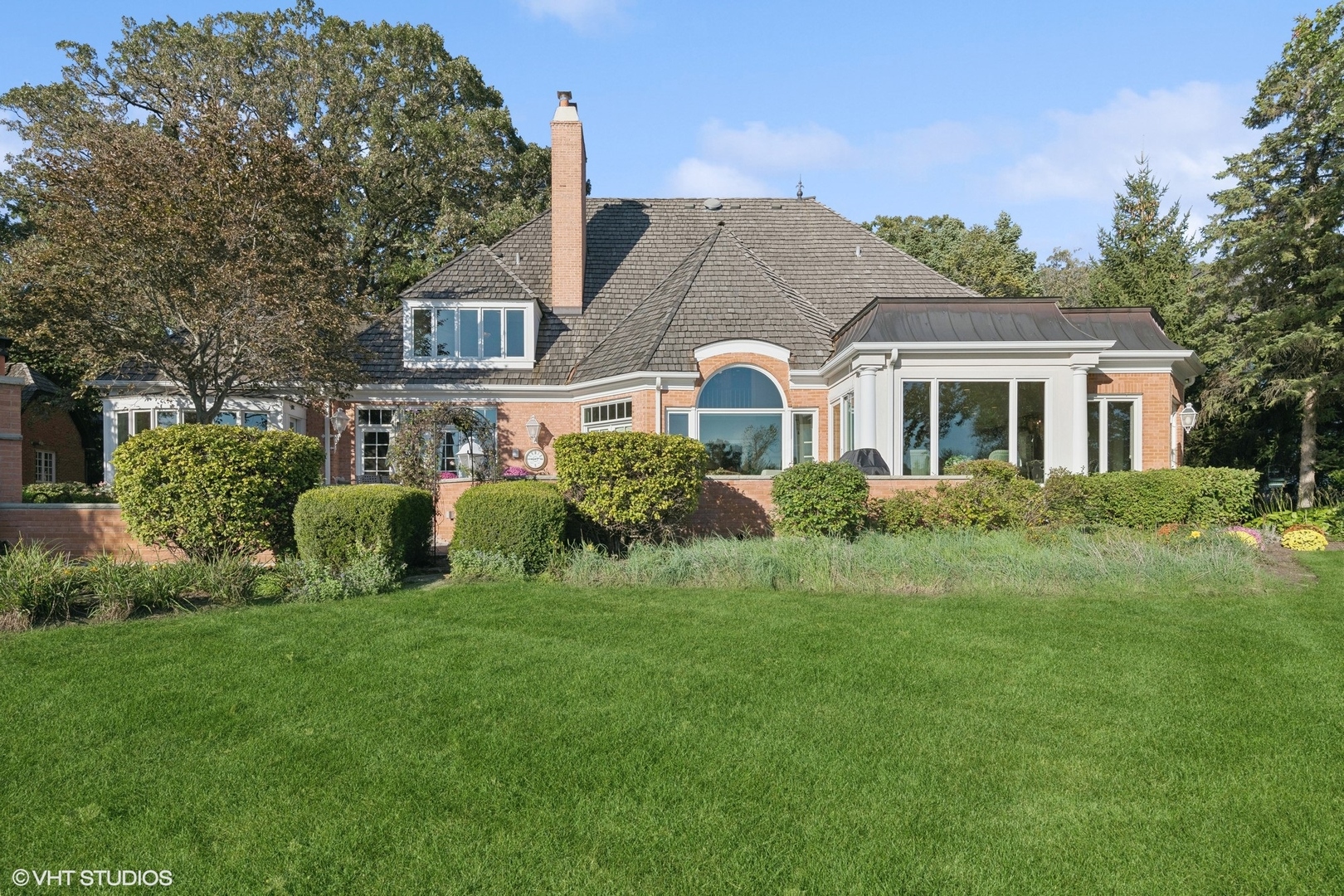 27 Riderwood Road North Barrington, IL 60010 - Photo 54 of 58 a front view of a house with a garden and trees