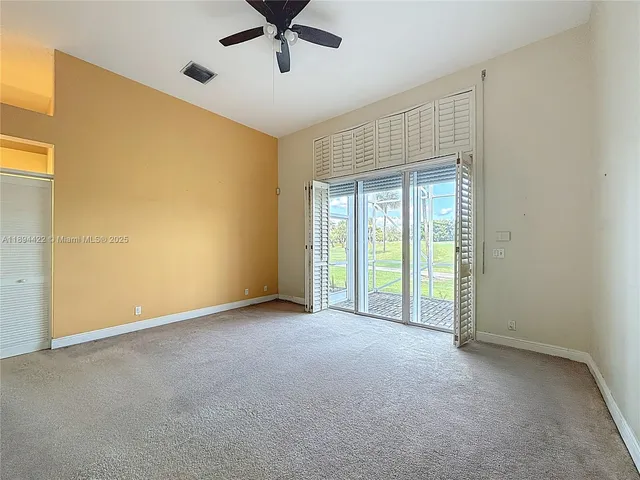 a spacious bathroom with a double vanity sink and a mirror