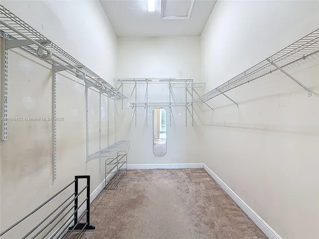 a bathroom with a tub sink mirror and a shower